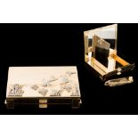 A 14CT GOLD MAKEUP BOX, with raised, diamond set duck hunting scene on lid,