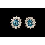 A PAIR OF BLUE GEMSET AND DIAMOND EARRINGS, of cluster design,