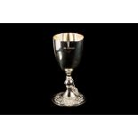 A MODERN SILVER GOBLET WITH EMBOSSED FOOT Sheffield 1977.