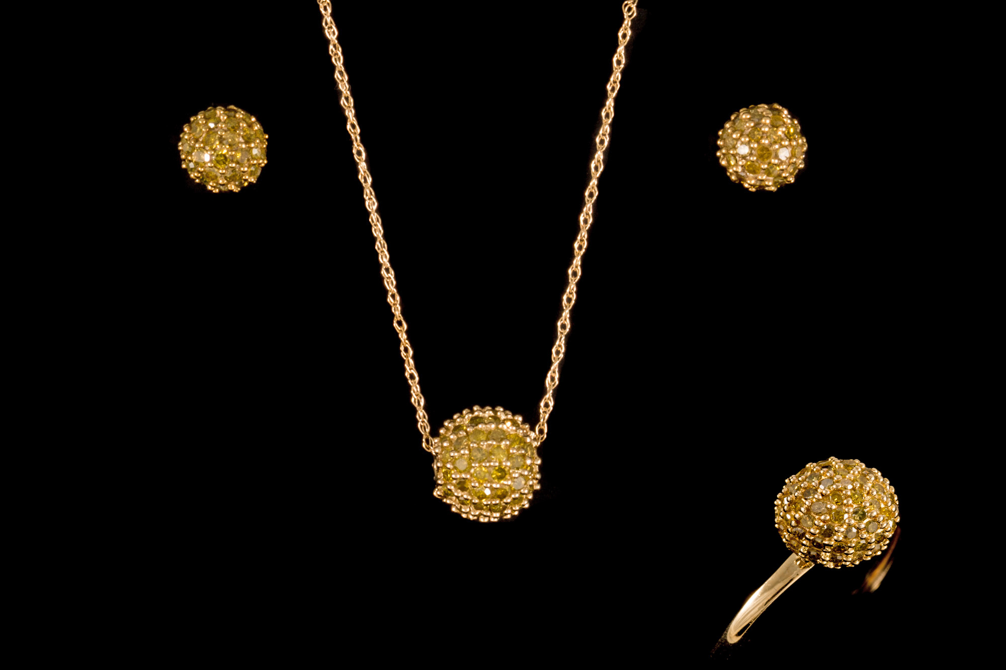 A PAIR OF YELLOW DIAMOND PAVE SET EARRINGS, of domed form,