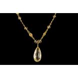 A CITRINE PENDANT AND CHAIN,