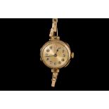 A LADIES ANTIQUE GOLD WRIST WATCH,