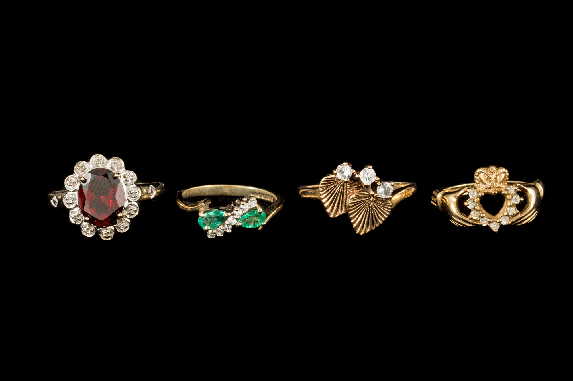 FOUR GEM SET RINGS,