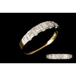 A DIAMOND HALF ETERNITY RING, set with baguette and brilliant cut diamonds,