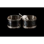 A PAIR OF MODERN SILVER NAPKIN RINGS WITH APPLIED CELTIC BORDER Birmingham 1960.