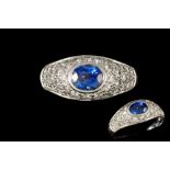 A SAPPHIRE AND DIAMOND BOMBÉ RING, one oval cut sapphire of 1.