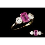 A PINK SAPPHIRE AND DIAMOND THREE STONE RING, one step cut pink sapphire of 2.