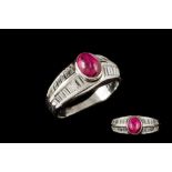 A CABACHON RUBY AND DIAMOND DRESS RING,