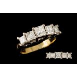 A FIVE STONE DIAMOND RING, with graduated princess cut diamonds, mounted in 18ct gold.