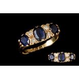 A SAPPHIRE AND DIAMOND CARVED DRESS RING, mounted in 18ct gold. Estimated; weight of sapphire; 1.