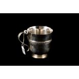 A MODERN SILVER CHRISTENING MUG WITH APPLIED CELTIC BAND, London,