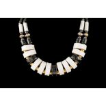 A BLACK AND WHITE ENAMEL FANCY NECKLACE.