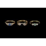 THREE GEM SET THREE STONE RINGS,