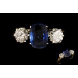 A SAPPHIRE AND DIAMOND THREE STONE RING, one cushion cut sapphire of approx. 1.