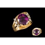 AN 18CT YELLOW GOLD AMETHYST AND DIAMOND DRESS RING.