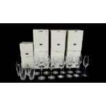 A QUANTITY OF MODERN WATERFORD CRYSTAL DRINKING GLASSES BY John Rocha, termed "Flow", boxed.