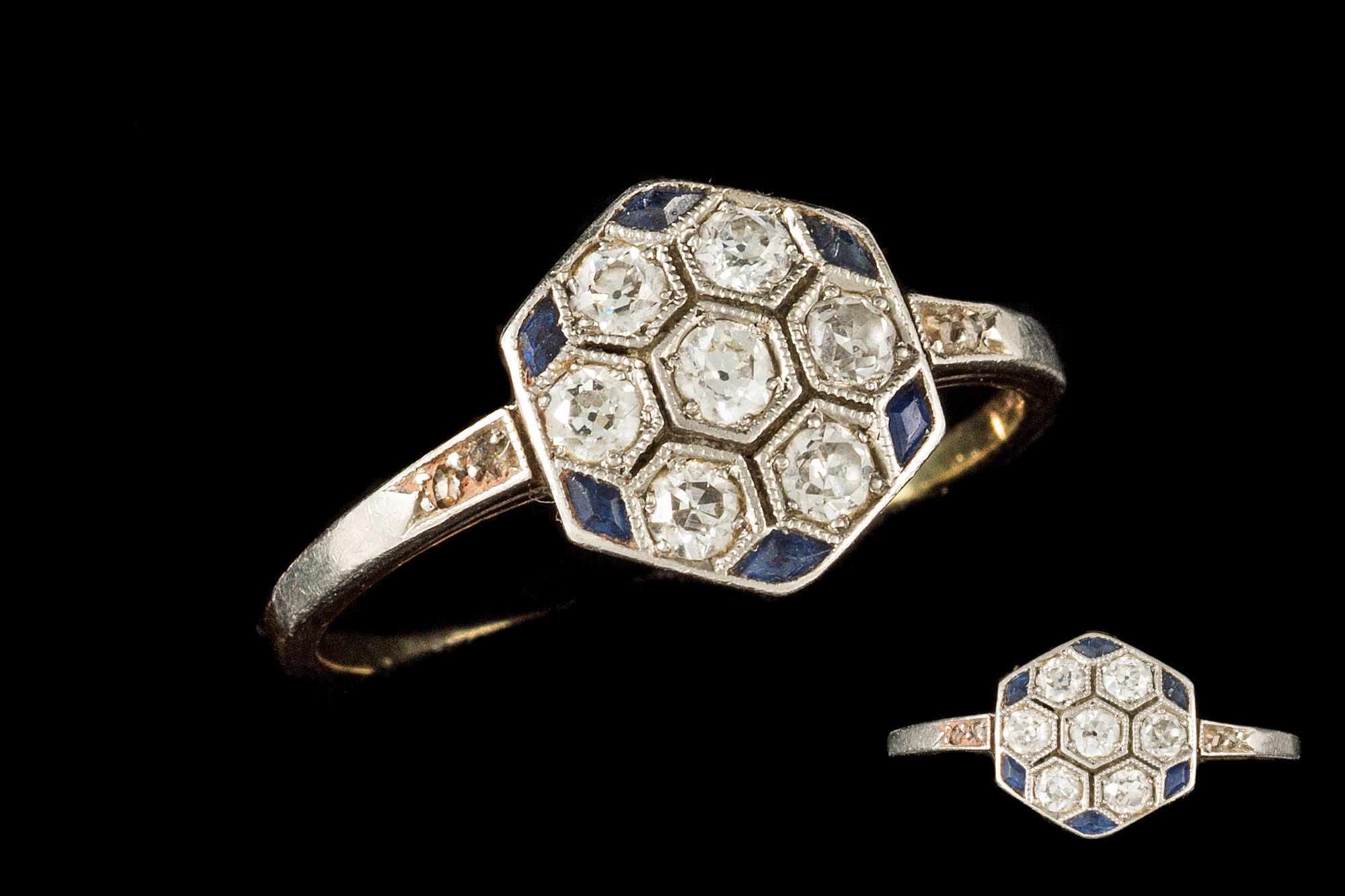 A SAPPHIRE AND DIAMOND HEXAGONAL CLUSTER RING, circa 1920's,