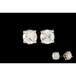 A PAIR OF DIAMOND STUD EARRINGS, set with brilliant cut diamonds, mounted in white gold.