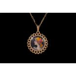 AN ENAMELLED PORTRAIT PENDANT, gold framed,