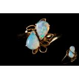 A TWO STONE OPAL RING,