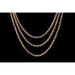 AN ANTIQUE GOLD MUFF CHAIN,