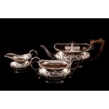 A LATE VICTORIAN HEAVY SILVER THREE PIECE TEA SERVICE,