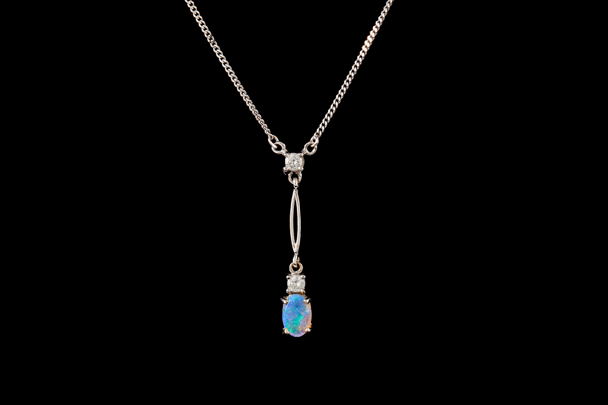 AN OPAL AND DIAMOND PENDANT AND CHAIN, 9ct white gold, the opal weighing; 0.25ct and the diamond; 0.