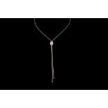 A BARRELL SHAPE SLIDER PENDANT AND CHAIN BY PIAGET,