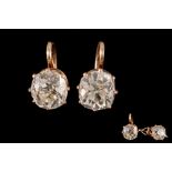 A PAIR OF DIAMOND SOLITAIRE EARRINGS, with old brilliant cut diamonds weighing approximately 1.