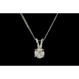 A DIAMOND SOLITAIRE PENDANT, mounted in white gold, on a chain. Estimated; weight of diamond; 0.