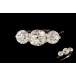 A DIAMOND THREE STONE RING, three old European brilliant cut diamonds of approximately 2.