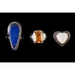 A COLLECTION OF THREE STONE SET DRESS RINGS,