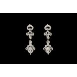 A PAIR OF DIAMOND DROP EARRINGS, set throughout with brilliant cut diamonds,