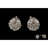 A PAIR OF DIAMOND SOLITAIRE EAR-STUDS, with round brilliant cut diamonds weighing approximately 1.