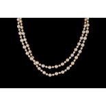 A CULTURED PEARL NECKLACE WITH DIAMOND CLASP,