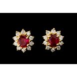 A PAIR OF DIAMOND AND RUBY CLUSTER EARRINGS, of oval form,