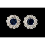 A PAIR OF DIAMOND AND SAPPHIRE CLUSTER EARRINGS, of circular form, mounted in 18ct gold.