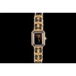 A CHANEL PREMIERE GOLD PLATED LADIES QUARTZ WRIST WATCH, black face,