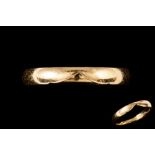 AN 18CT YELLOW GOLD BAND RING