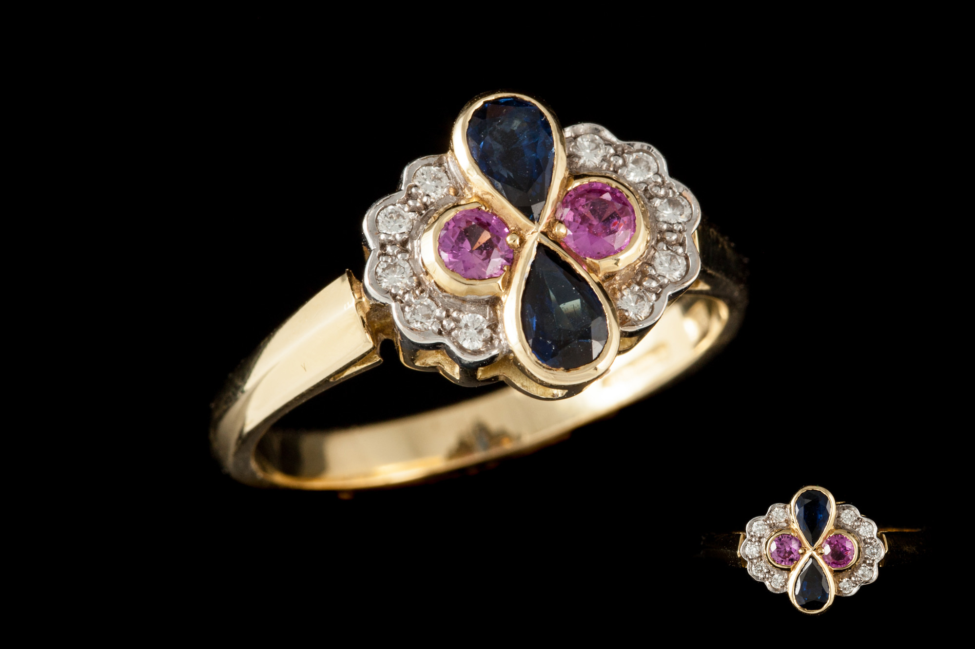 A PINK SAPPHIRE AND DIAMOND CLUSTER RING, mounted on 18ct gold,