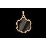 AN ONYX PENDANT,