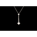 A DIAMOND DROP PENDANT AND CHAIN BY TIFFANY & CO, with diamonds of approx. 0.