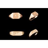 A DIAMOND SET SIGNET RING,