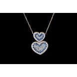 A SAPPHIRE AND DIAMOND PAVÉ HEART MOTIF PENDANT AND CHAIN, with sapphires of approx 3.50ct and