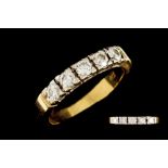 A DIAMOND FIVE STONE HALF ETERNITY RING,