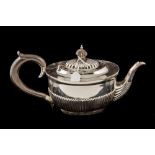 A VICTORIAN SILVER TEAPOT, with gadrooned decoration,