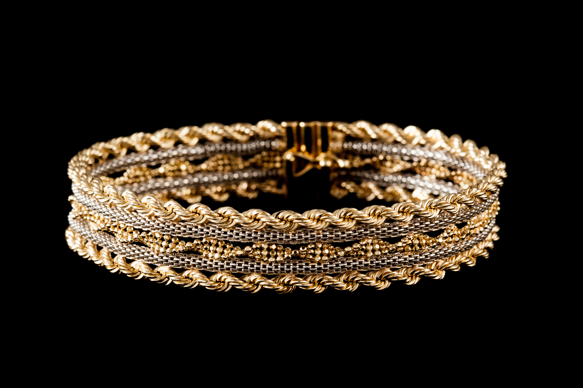 A 14CT YELLOW AND WHITE GOLD FANCY LINK BRACELET