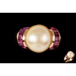 A PEARL AND RUBY RING,