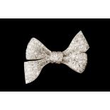 A DIAMOND BOW BROOCH, circa 1930, set throughout with diamonds of approx 9.