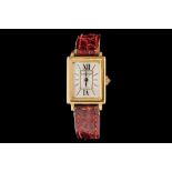 A LADIES CARTIER TANK WATCH IN 18CT GOLD, manual mechanical mechanism,